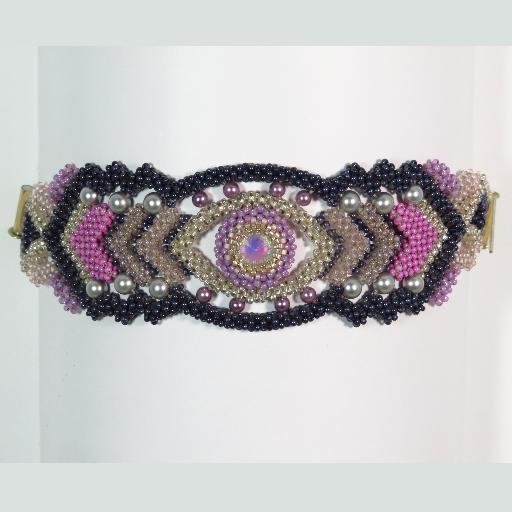 Intricate purple beaded right angle weave cuff bracelet by Bonnie Van Hall