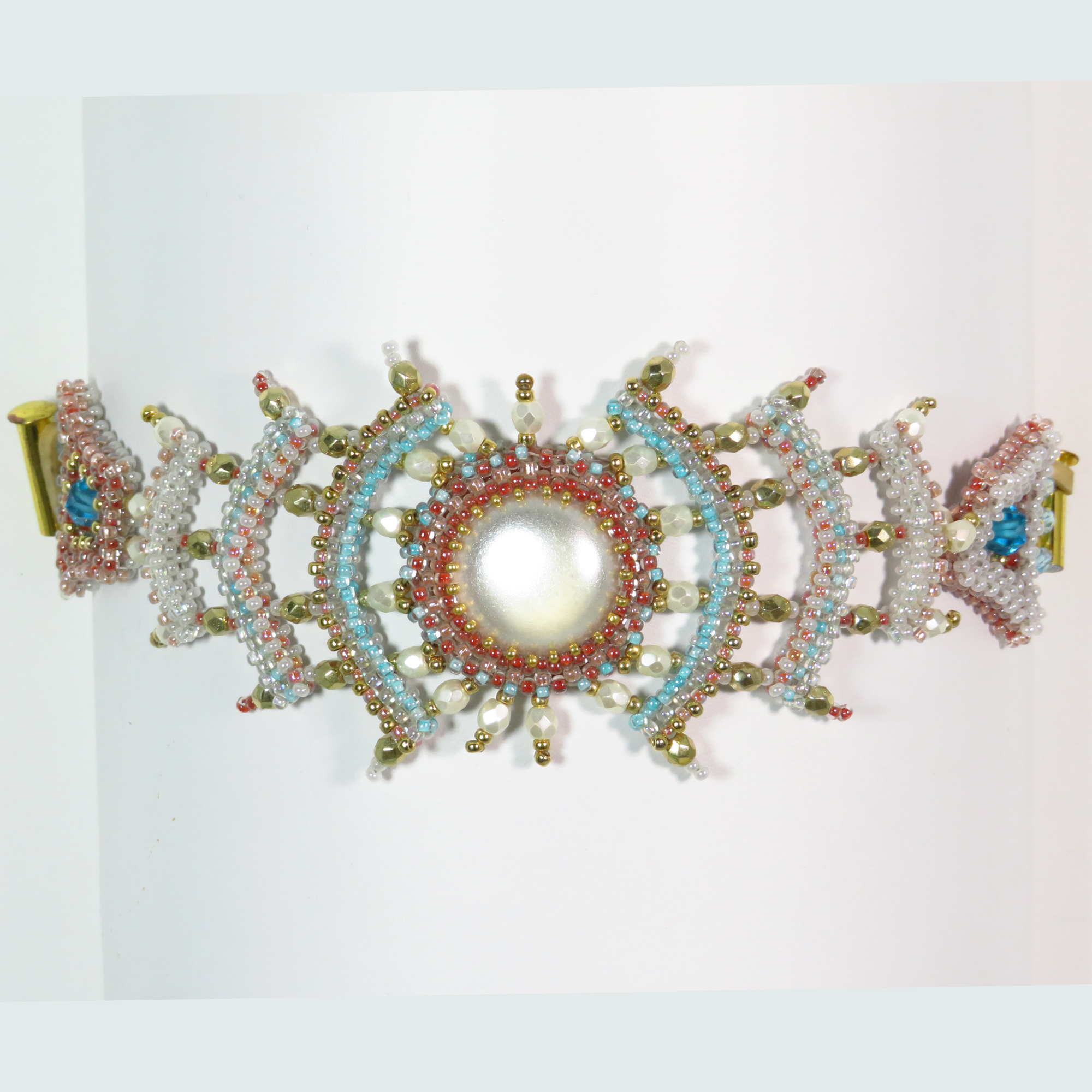 Pale colors beaded radial spokes bracelet by Bonnie Van Hall