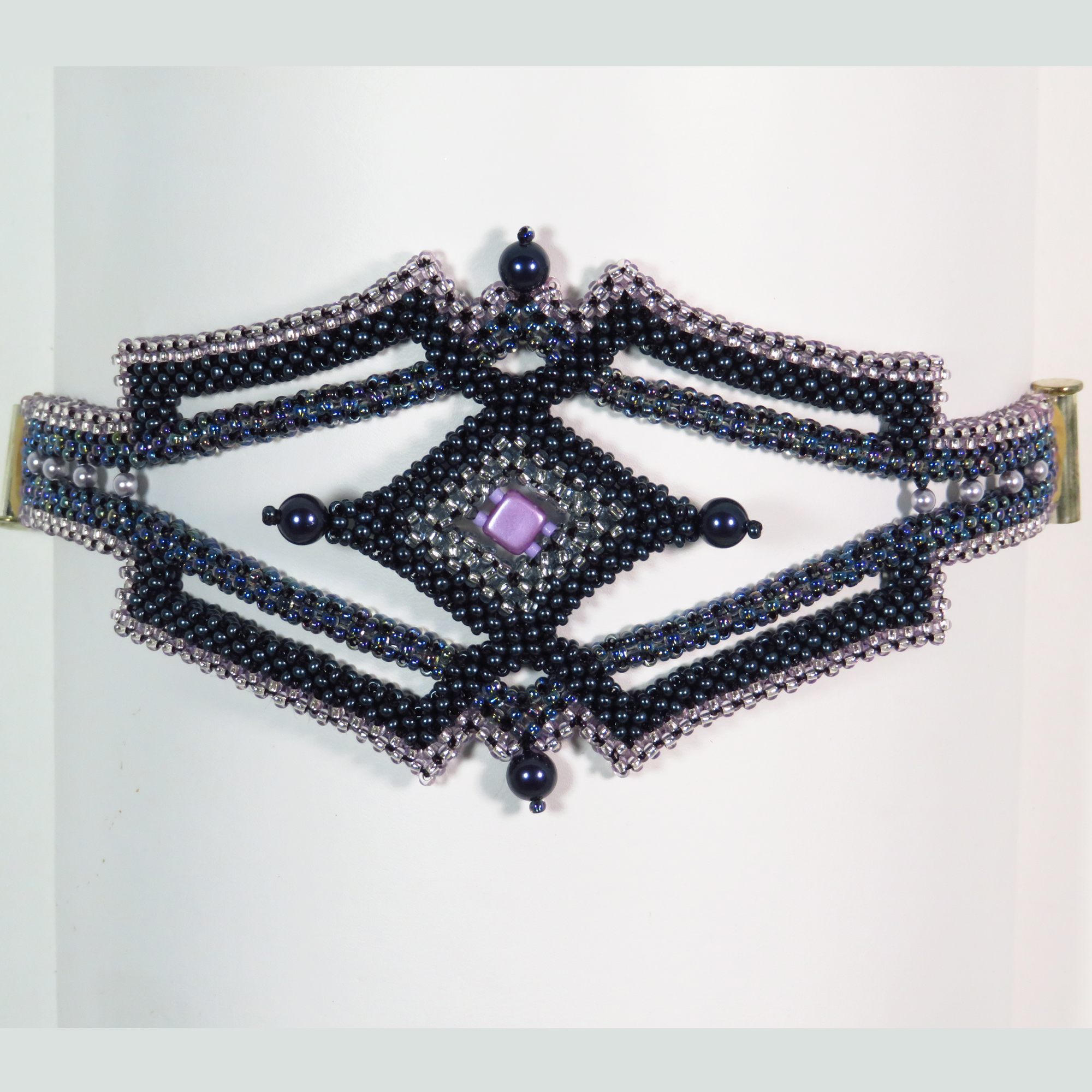 Geometric purple beaded right angle weave  cuff bracelet by Bonnie Van Hall